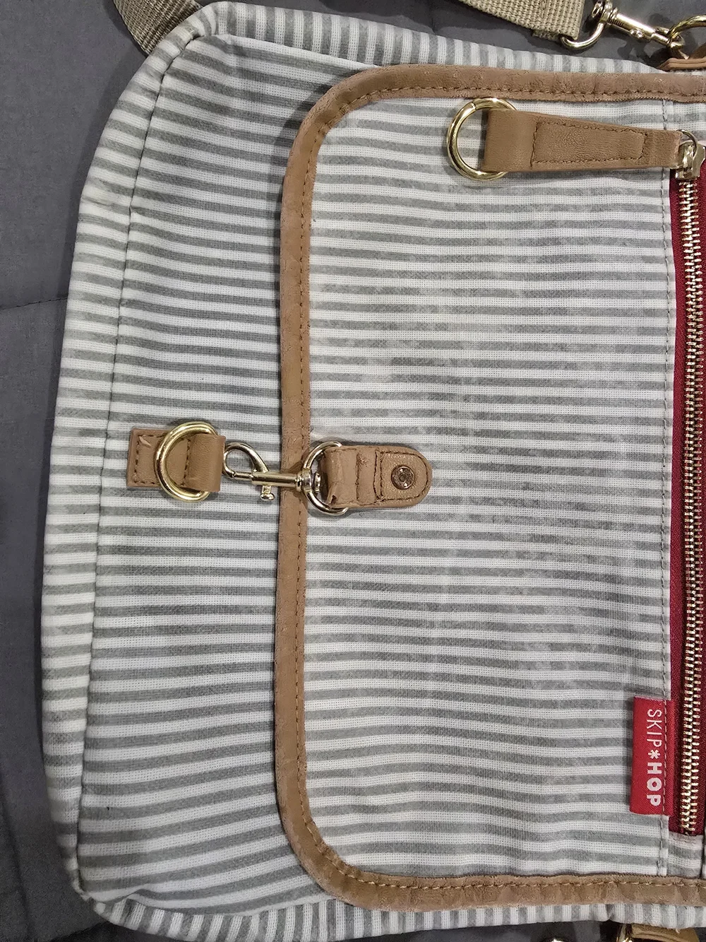 Skip Hop Gray and White Striped Messenger Bag with Tan Trim and Red Accent